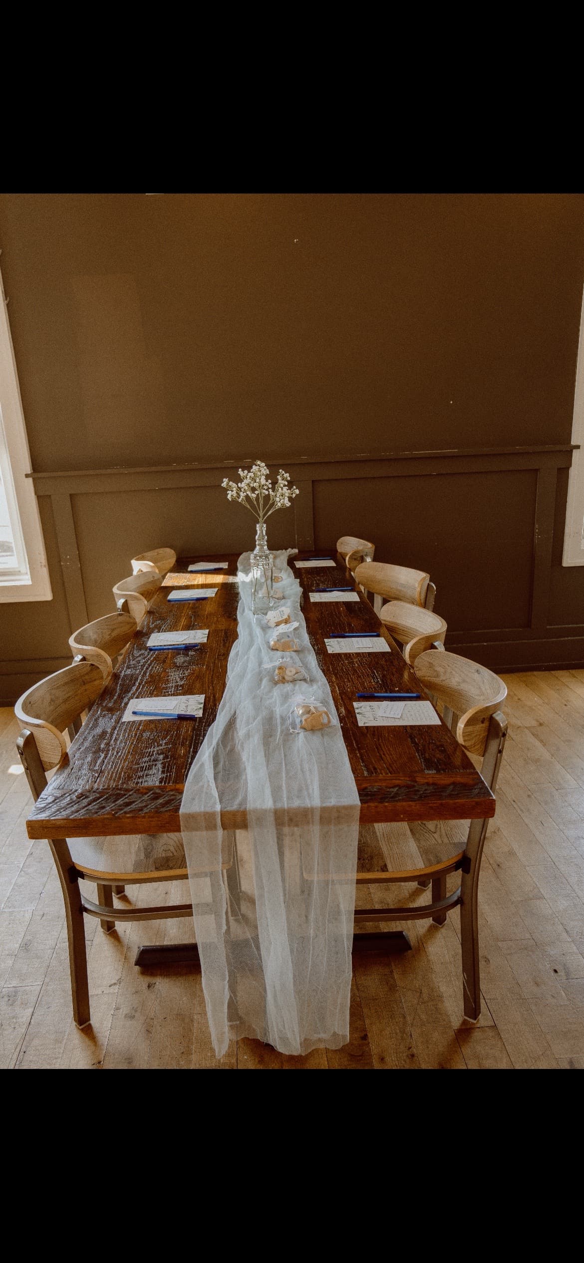 Wood farm-table tablescape with sheer runner, styled by Pop & Party Co.