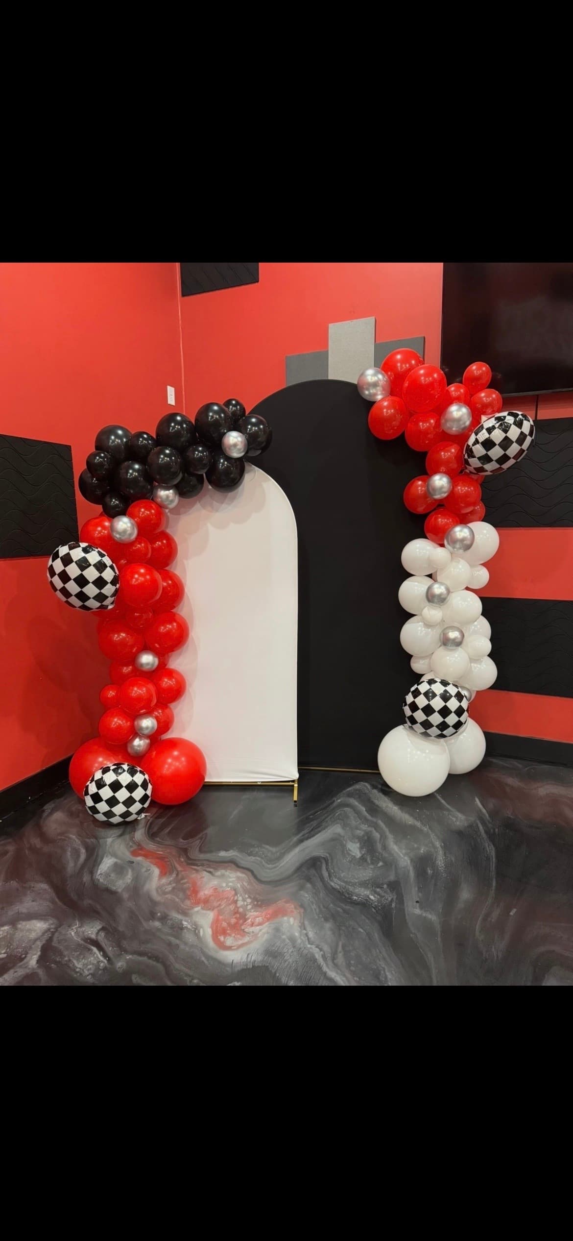 Themed balloon arch and backdrop styled by Pop & Party Co.